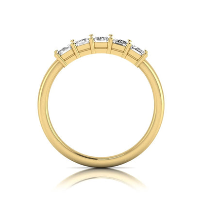 Emerald cut five stone lab grown diamond anniversary ring featuring five emerald cut diamonds in a shared prong setting with a yellow gold tone band.
