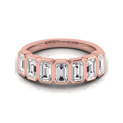 Emerald cut lab grown diamond bezel seven stone band featuring 2.03 carats of bezel set emerald diamonds in rose gold.