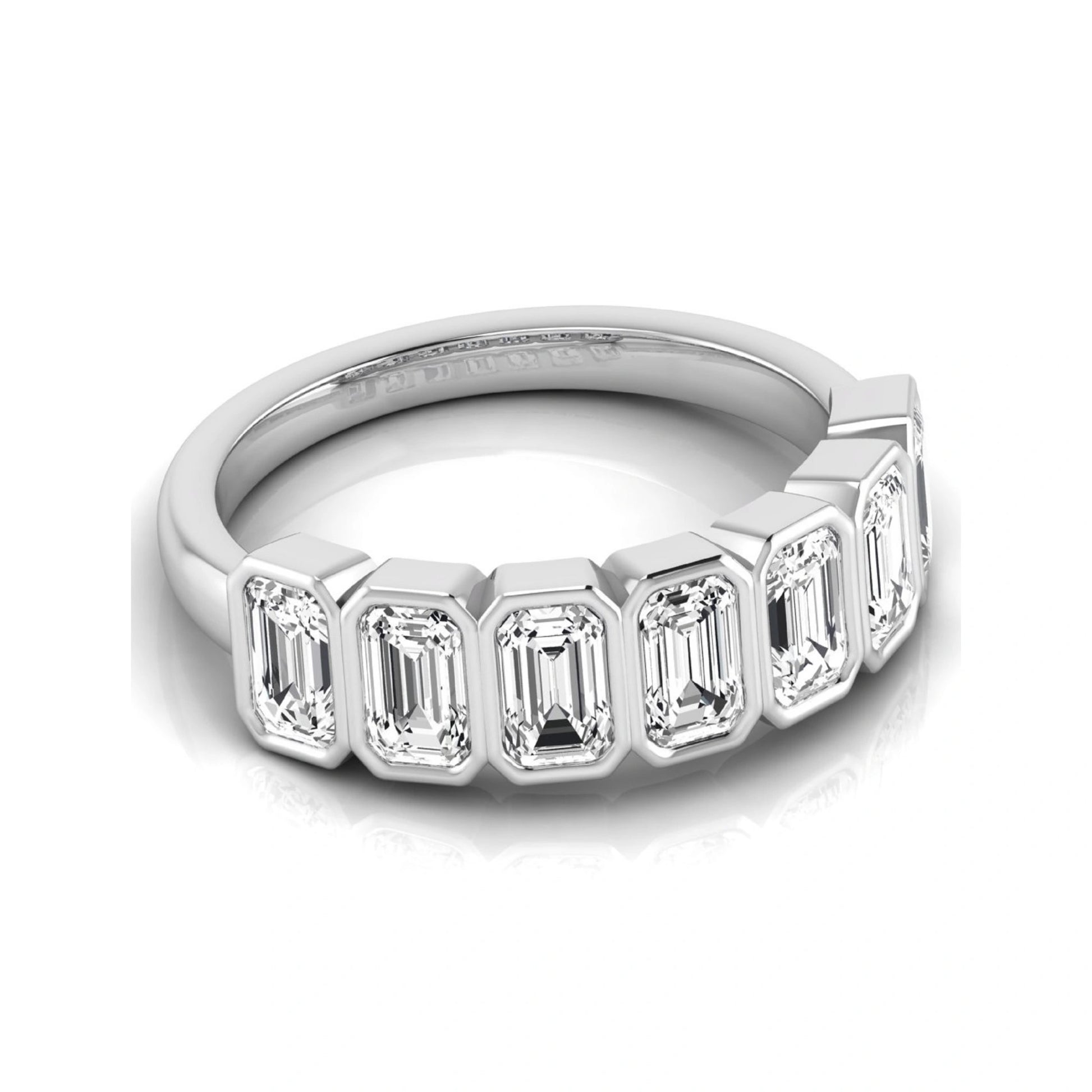 Emerald cut lab grown diamond bezel seven stone band featuring 2.03 carats of bezel set emerald diamonds in white gold.