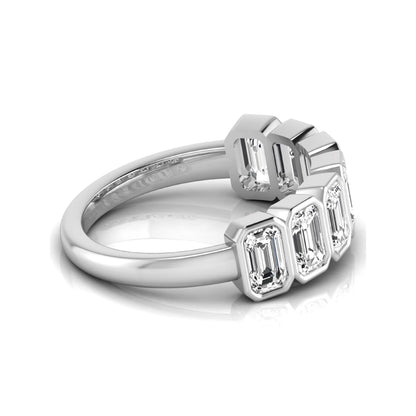 Emerald cut lab grown diamond bezel seven stone band featuring 2.03 carats of bezel set emerald diamonds in white gold.