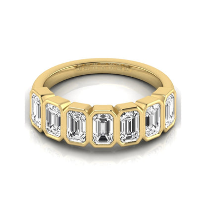 Emerald cut lab grown diamond bezel seven stone band featuring 2.03 carats of bezel set emerald diamonds in yellow gold.