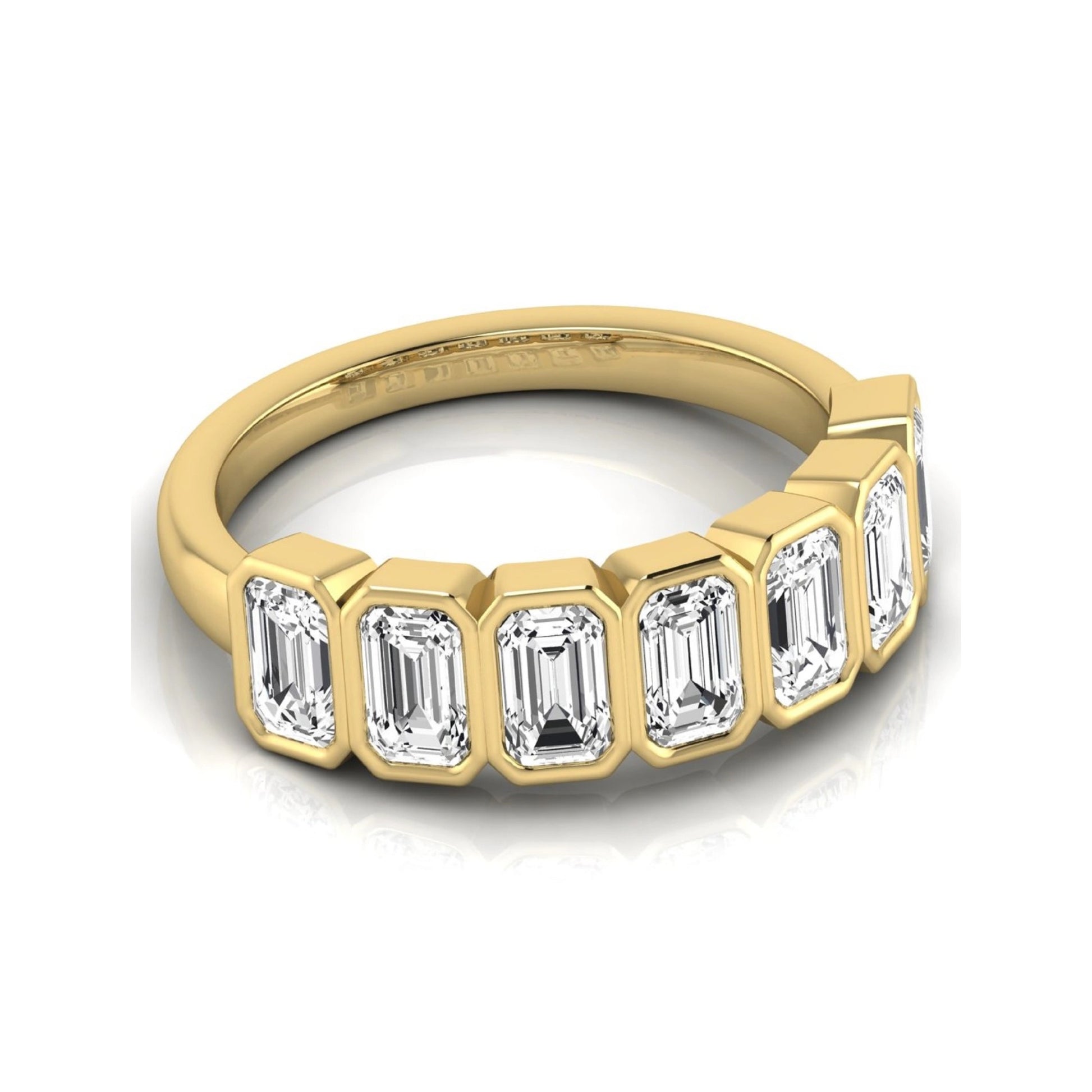 Emerald cut lab grown diamond bezel seven stone band featuring 2.03 carats of bezel set emerald diamonds in yellow gold.