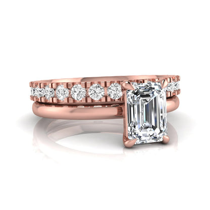Emerald cut lab grown diamond bridal ring set featuring a 1.06 carat IGI certified center diamond with a matching round diamond wedding band in rose gold.