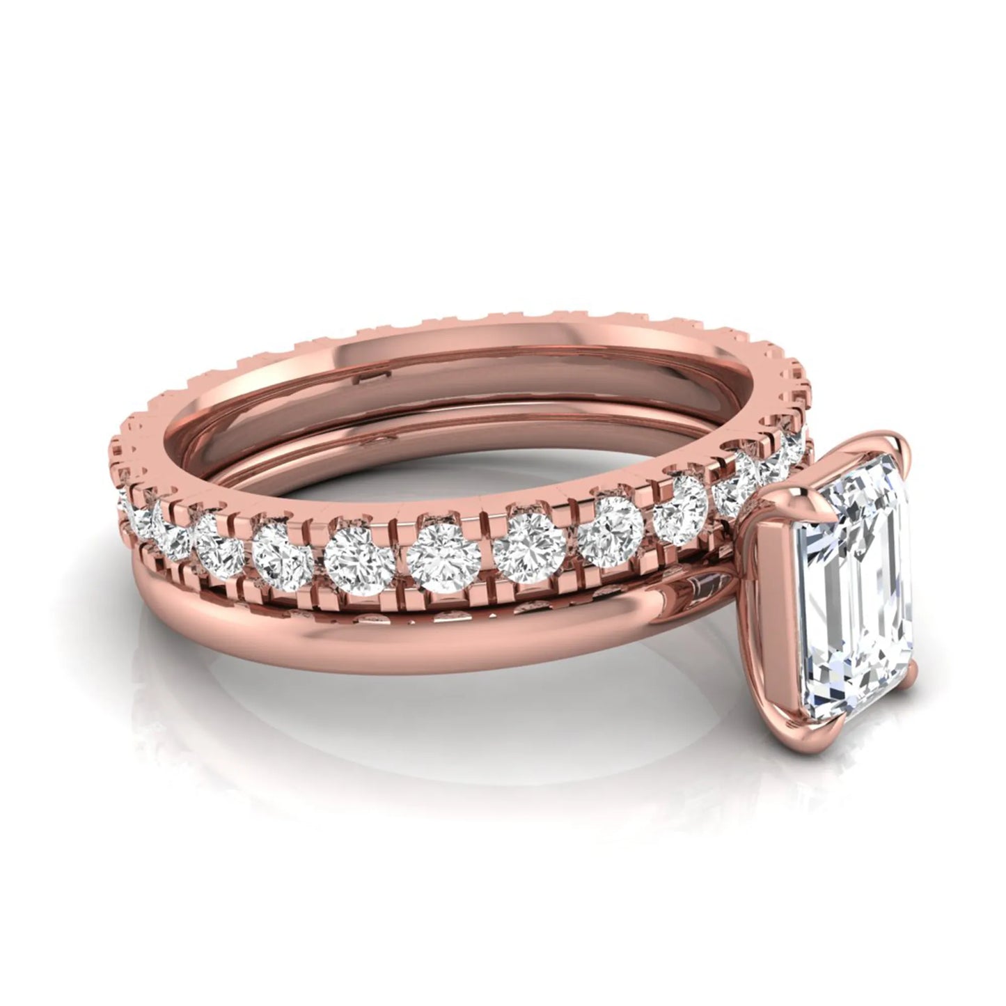 Emerald cut lab grown diamond bridal ring set featuring a 1.06 carat IGI certified center diamond with a matching round diamond wedding band in rose gold.