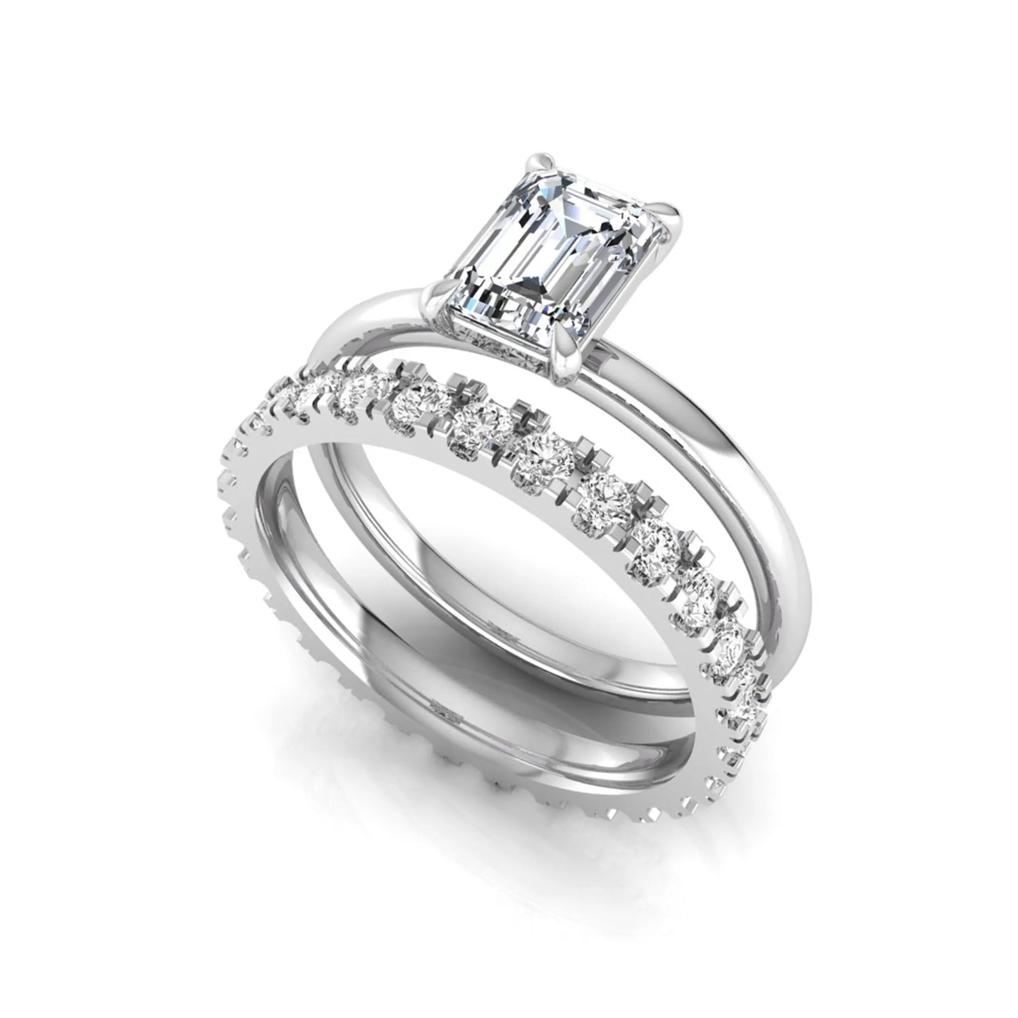 Emerald cut lab grown diamond bridal ring set featuring a 1.06 carat IGI certified center diamond with a matching round diamond wedding band in white gold.