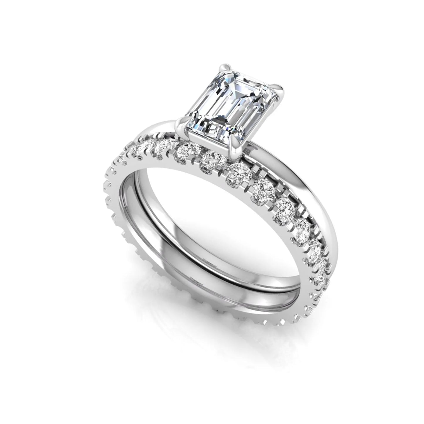 Emerald cut lab grown diamond bridal ring set featuring a 1.06 carat IGI certified center diamond with a matching round diamond wedding band in white gold.