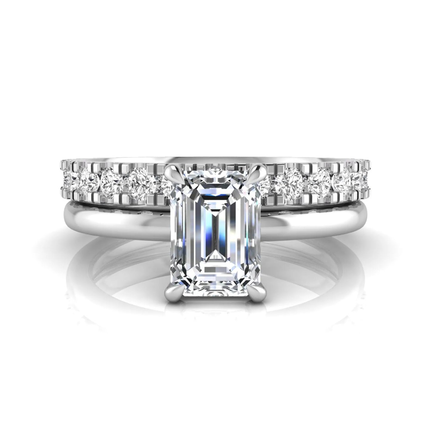 Emerald cut lab grown diamond bridal ring set featuring a 1.06 carat IGI certified center diamond with a matching round diamond wedding band in white gold.