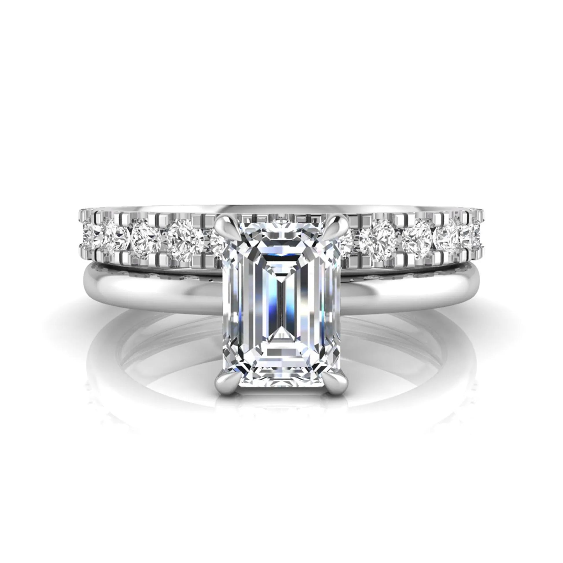 Emerald cut lab grown diamond bridal ring set featuring a 1.06 carat IGI certified center diamond with a matching round diamond wedding band in white gold.