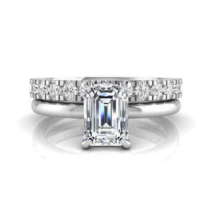 Emerald cut lab grown diamond bridal ring set featuring a 1.06 carat IGI certified center diamond with a matching round diamond wedding band in white gold.
