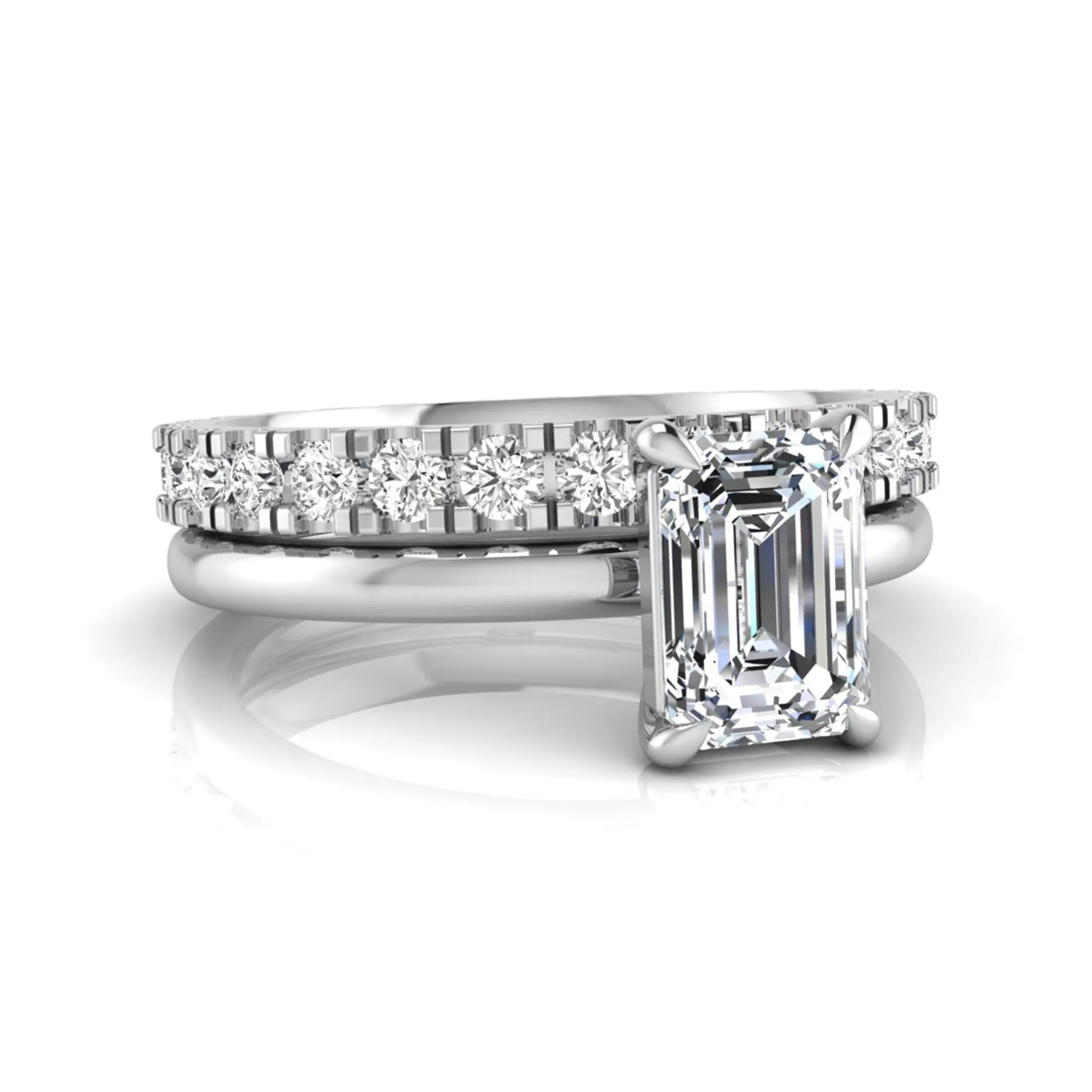 Emerald cut lab grown diamond bridal ring set featuring a 1.06 carat IGI certified center diamond with a matching round diamond wedding band in white gold.