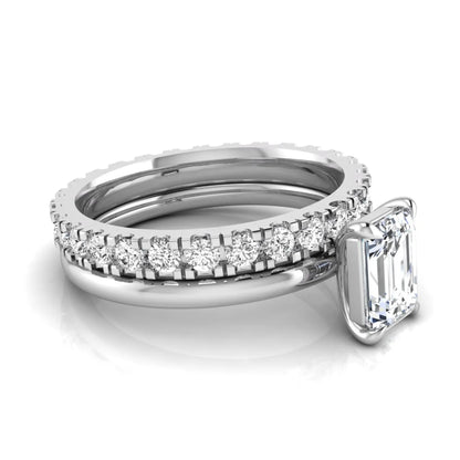 Emerald cut lab grown diamond bridal ring set featuring a 1.06 carat IGI certified center diamond with a matching round diamond wedding band in white gold.