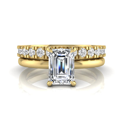 Emerald cut lab grown diamond bridal ring set featuring a 1.06 carat IGI certified center diamond with a matching round diamond wedding band in yellow gold.