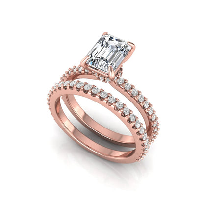 Emerald cut lab grown diamond bridal ring set featuring a 1.74 carat IGI certified emerald cut center diamond with a matching pavé diamond wedding band in rose gold