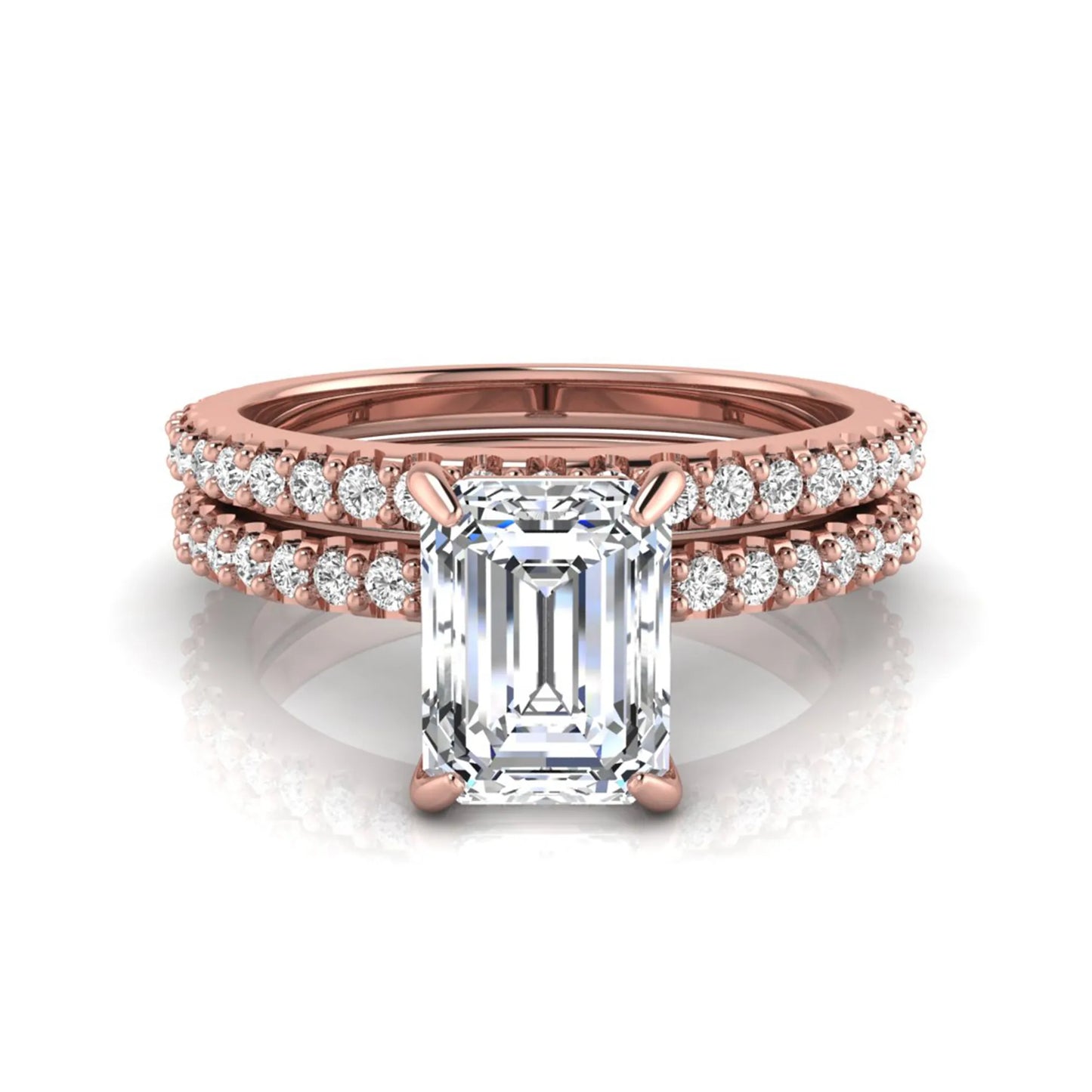 Emerald cut lab grown diamond bridal ring set featuring a 1.74 carat IGI certified emerald cut center diamond with a matching pavé diamond wedding band in rose gold
