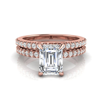Emerald cut lab grown diamond bridal ring set featuring a 1.74 carat IGI certified emerald cut center diamond with a matching pavé diamond wedding band in rose gold