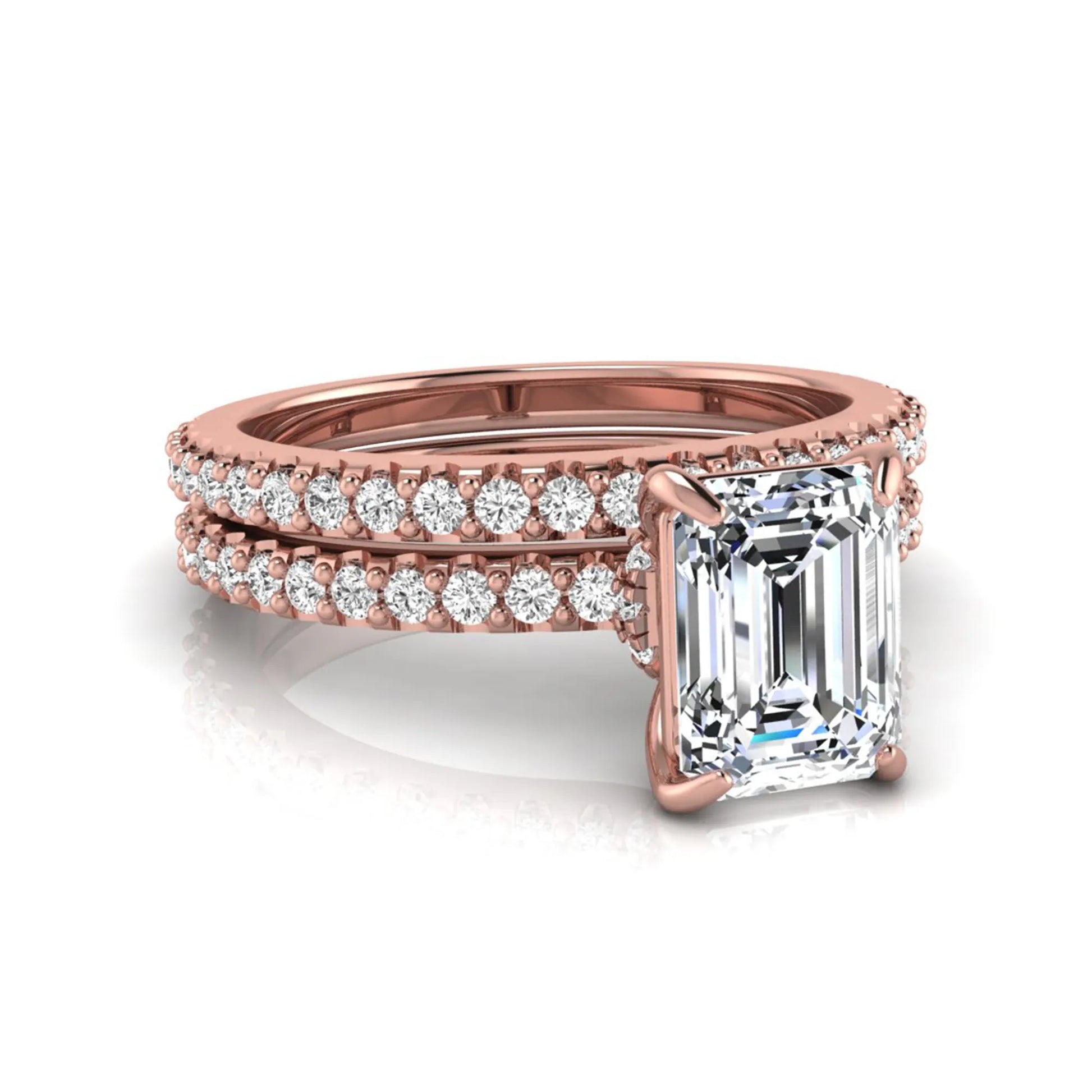 Emerald cut lab grown diamond bridal ring set featuring a 1.74 carat IGI certified emerald cut center diamond with a matching pavé diamond wedding band in rose gold