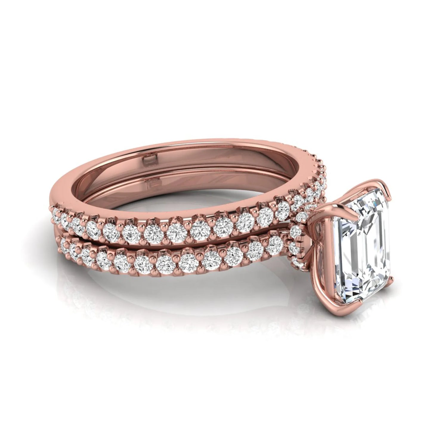 Emerald cut lab grown diamond bridal ring set featuring a 1.74 carat IGI certified emerald cut center diamond with a matching pavé diamond wedding band in rose gold