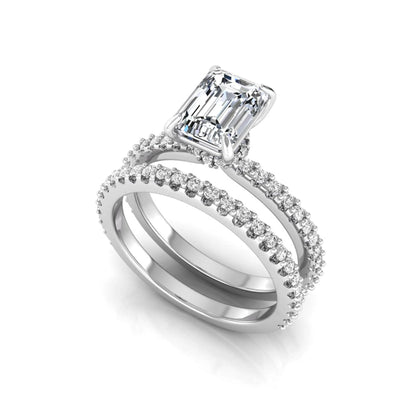 Emerald cut lab grown diamond bridal ring set featuring a 1.74 carat IGI certified emerald cut center diamond with a matching pavé diamond wedding band in white gold