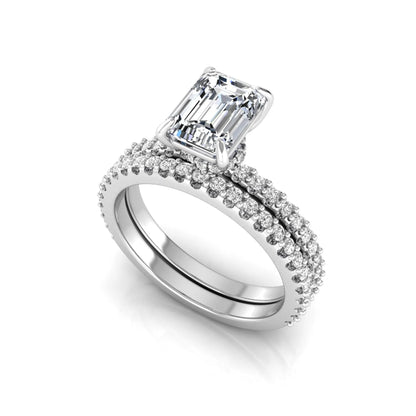 Emerald cut lab grown diamond bridal ring set featuring a 1.74 carat IGI certified emerald cut center diamond with a matching pavé diamond wedding band in white gold