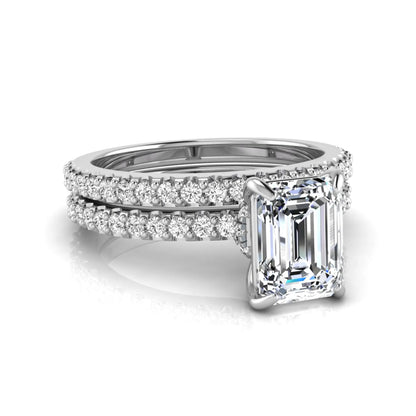 Emerald cut lab grown diamond bridal ring set featuring a 1.74 carat IGI certified emerald cut center diamond with a matching pavé diamond wedding band in white gold
