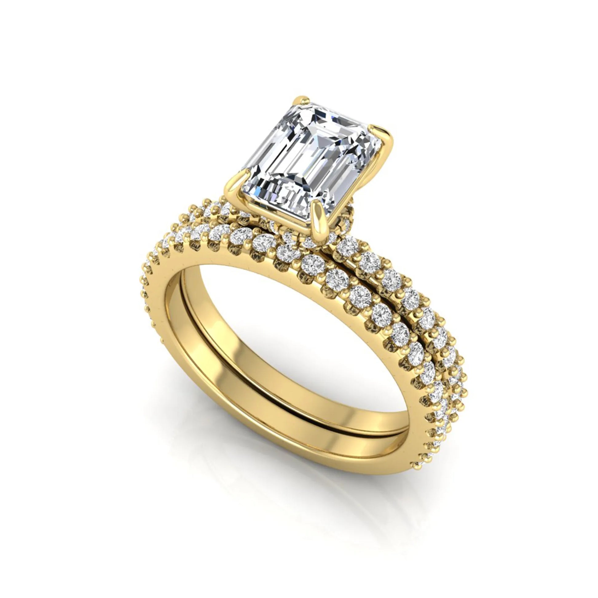 Emerald cut lab grown diamond bridal ring set featuring a 1.74 carat IGI certified emerald cut center diamond with a matching pavé diamond wedding band in yellow gold