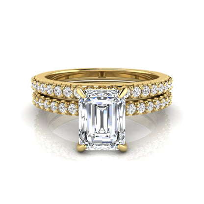 Emerald cut lab grown diamond bridal ring set featuring a 1.74 carat IGI certified emerald cut center diamond with a matching pavé diamond wedding band in yellow gold