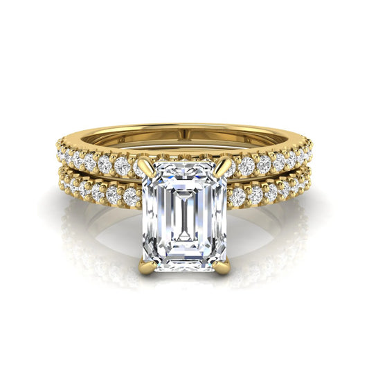 Emerald cut lab grown diamond bridal ring set featuring a 1.74 carat IGI certified emerald cut center diamond with a matching pavé diamond wedding band in yellow gold