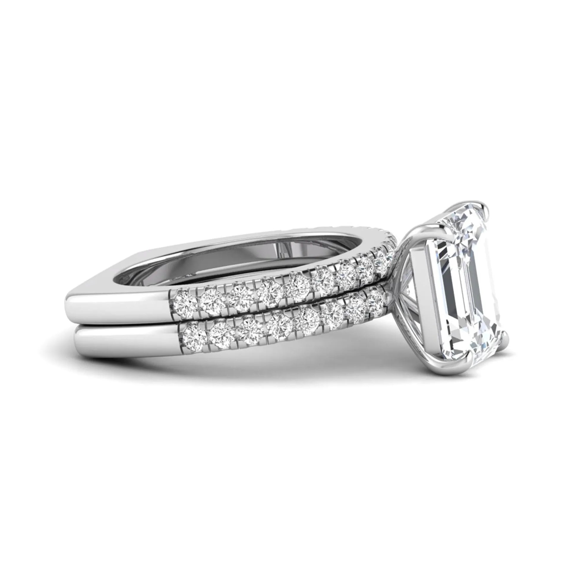 Emerald cut lab grown diamond Euro shank bridal ring set in white gold featuring a 5.21 carat IGI certified center diamond with matching diamond wedding band.