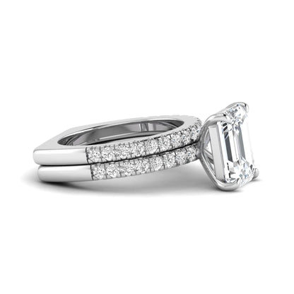 Emerald cut lab grown diamond Euro shank bridal ring set in white gold featuring a 5.21 carat IGI certified center diamond with matching diamond wedding band.