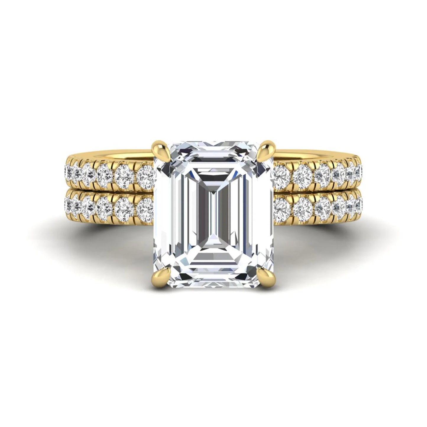 Emerald cut lab grown diamond Euro shank bridal ring set in yellow gold featuring a 5.21 carat IGI certified center diamond with matching diamond wedding band.