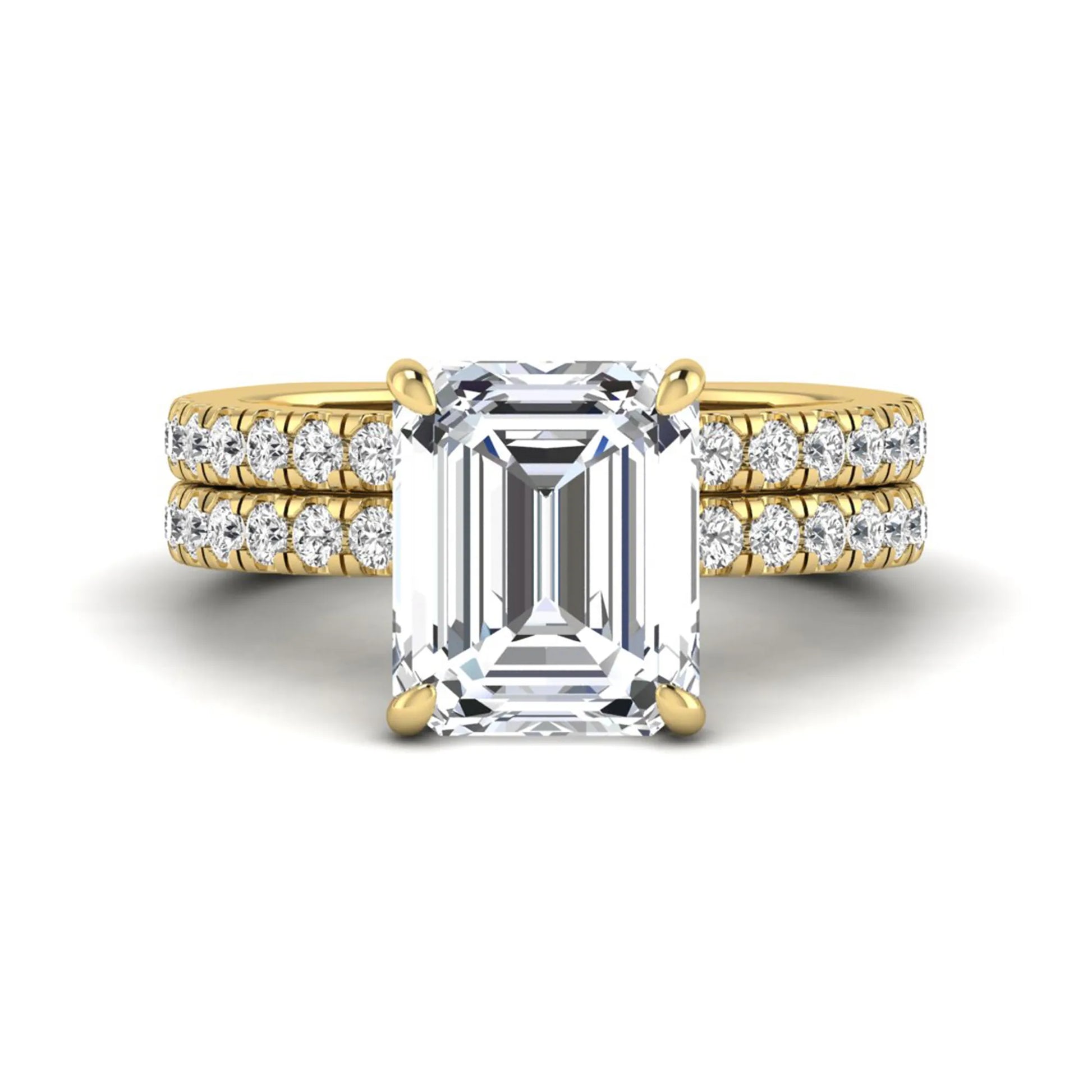 Emerald cut lab grown diamond Euro shank bridal ring set in yellow gold featuring a 5.21 carat IGI certified center diamond with matching diamond wedding band.