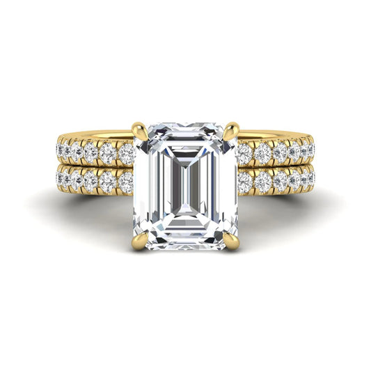 Emerald cut lab grown diamond Euro shank bridal ring set in yellow gold featuring a 5.21 carat IGI certified center diamond with matching diamond wedding band.