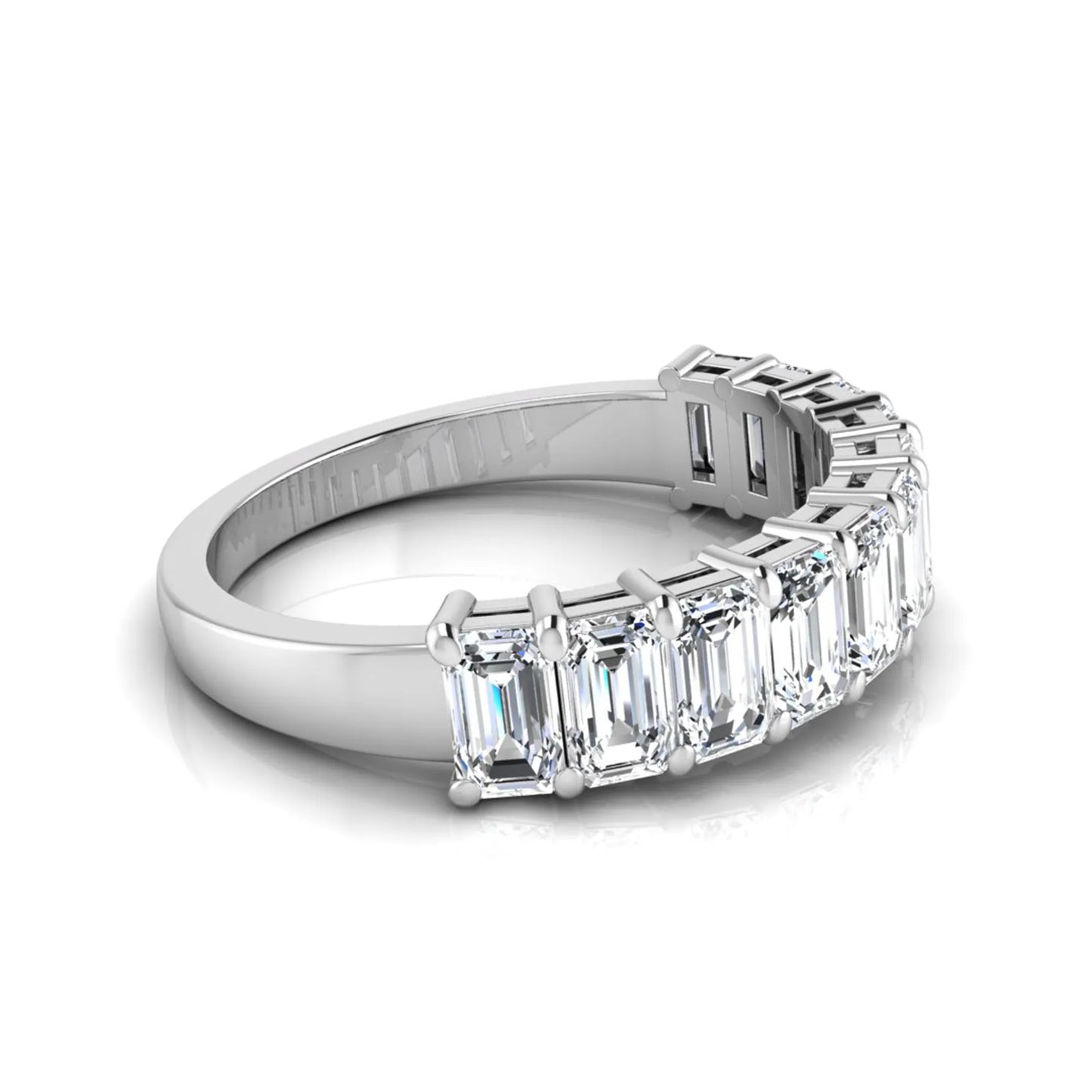 Emerald cut lab grown diamond half eternity band featuring shared prong set diamonds in a white gold tone finish.