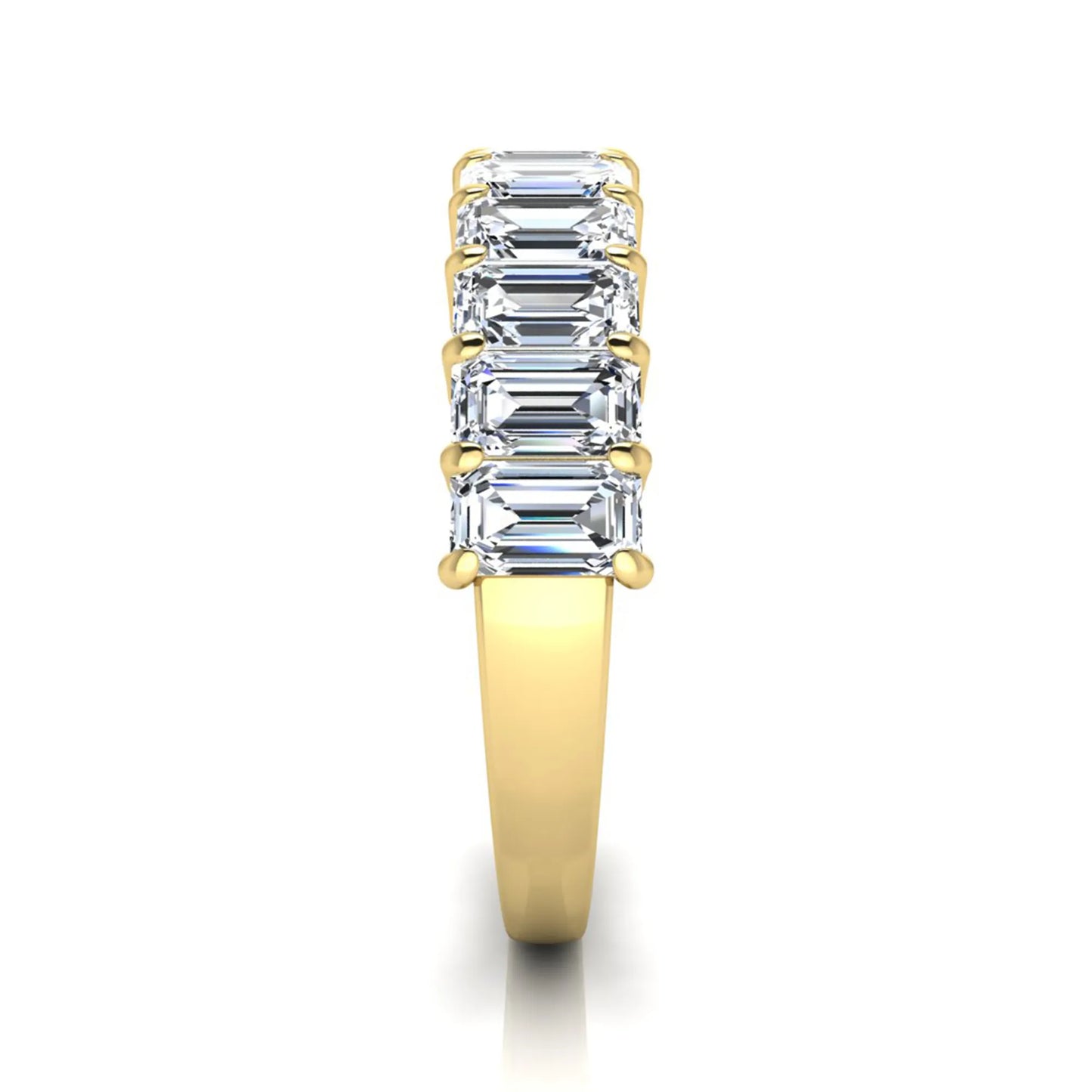 Emerald cut lab grown diamond half eternity band featuring shared prong set diamonds in a yellow gold tone finish.