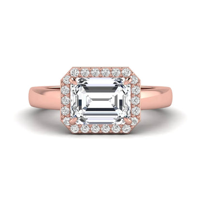 IGI certified emerald cut lab grown diamond halo engagement ring with round diamond halo in rose gold.