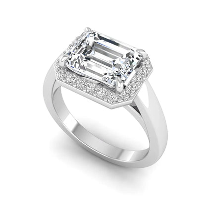 IGI certified emerald cut lab grown diamond halo engagement ring with round diamond halo in white gold.