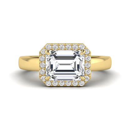 IGI certified emerald cut lab grown diamond halo engagement ring with round diamond halo in yellow gold.