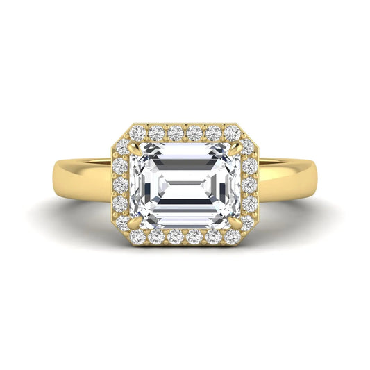 IGI certified emerald cut lab grown diamond halo engagement ring with round diamond halo in yellow gold.