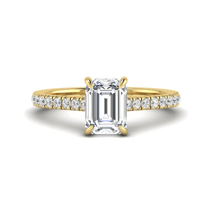 IGI certified emerald cut lab grown diamond hidden halo engagement ring with pavé round diamond band in yellow gold.