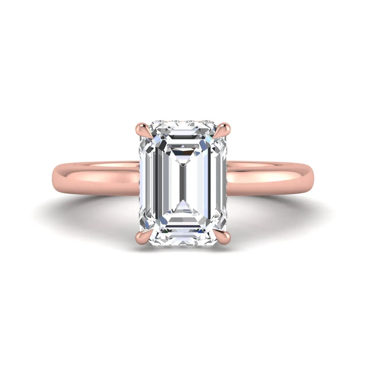 Emerald cut lab grown diamond hidden halo solitaire engagement ring in rose gold featuring a 3.01 carat IGI certified center diamond.