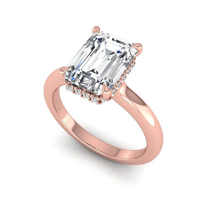 Emerald cut lab grown diamond hidden halo solitaire engagement ring in rose gold featuring a 3.01 carat IGI certified center diamond.