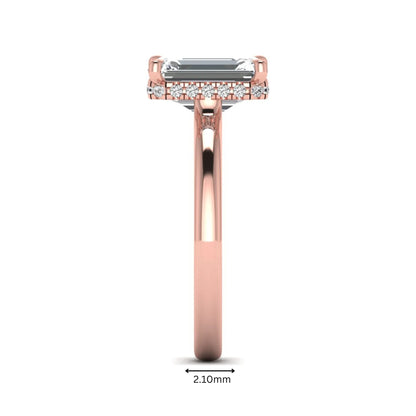 Emerald cut lab grown diamond hidden halo solitaire engagement ring in rose gold featuring a 3.01 carat IGI certified center diamond.