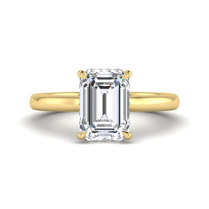 Emerald cut lab grown diamond hidden halo solitaire engagement ring in yellow gold featuring a 3.01 carat IGI certified center diamond.