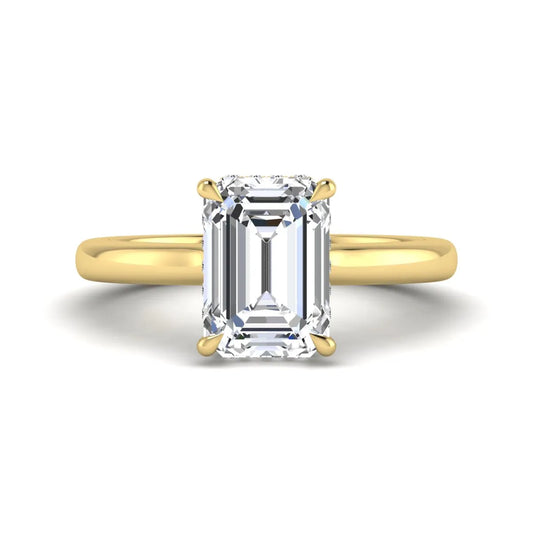 Emerald cut lab grown diamond hidden halo solitaire engagement ring in yellow gold featuring a 3.01 carat IGI certified center diamond.