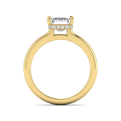 Emerald cut lab grown diamond hidden halo solitaire engagement ring in yellow gold featuring a 3.01 carat IGI certified center diamond.
