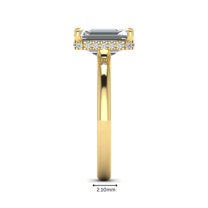 Emerald cut lab grown diamond hidden halo solitaire engagement ring in yellow gold featuring a 3.01 carat IGI certified center diamond.