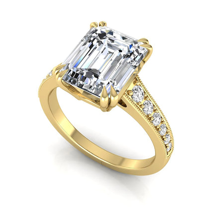 Emerald cut lab grown diamond engagement ring featuring a 3.79 carat IGI certified center diamond with round side diamonds and vintage milgrain detailing in yellow gold.