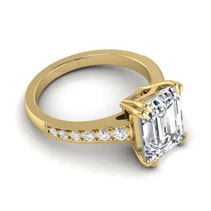 Emerald cut lab grown diamond engagement ring featuring a 3.79 carat IGI certified center diamond with round side diamonds and vintage milgrain detailing in yellow gold.