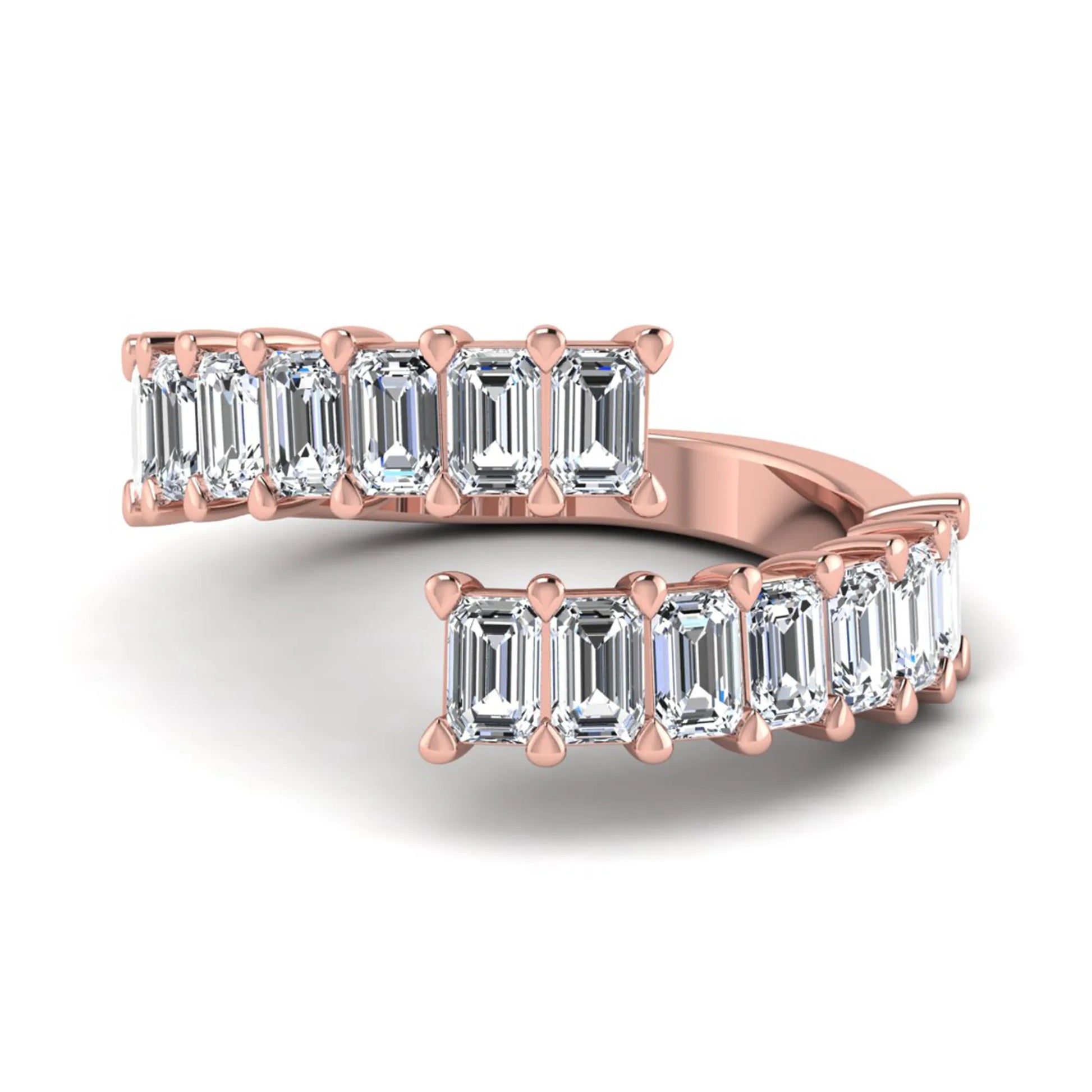 Emerald cut lab grown diamond open cuff bypass ring with prong setting in rose gold tone.