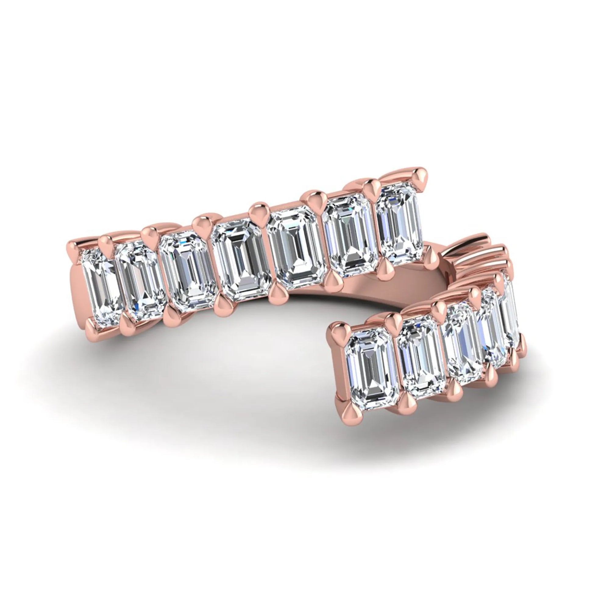 Emerald cut lab grown diamond open cuff bypass ring with prong setting in rose gold tone.